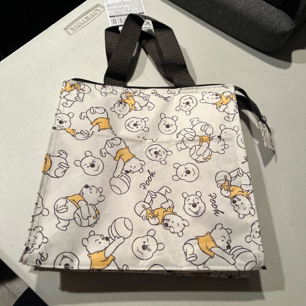 Disney Small lunch bag or bag for other items.  Pooh bear